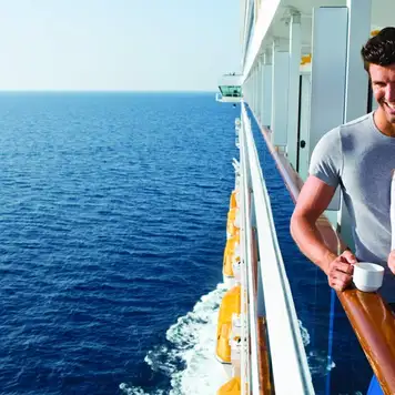 Image related to A couple enjoying coffees on their balcony