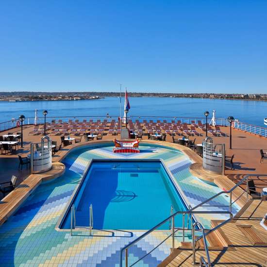 An aft-facing swimming pool surrounded by seating