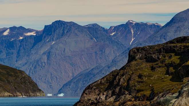 Sail past colourful settlements, iceberg-filled bays and the mountains of Greenland's lively west.