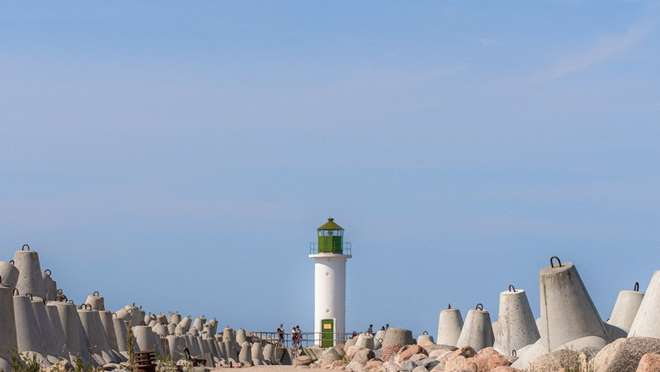 Discover a spotless Latvian port city of golden beaches, parks and quirky cow statues.