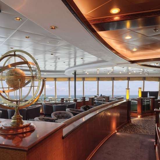 A globe statue on a counter overlooking a lounge area