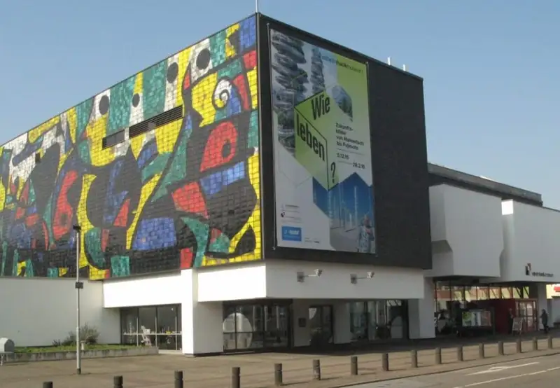 An image of a modern image with a colourful mosaic on one wall