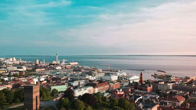 Explore a vibrant Swedish city across the sound from Denmark, crowned by a medieval tower.