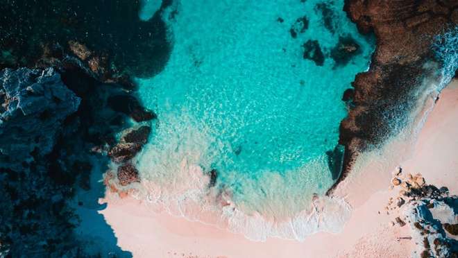 Explore a remote archipelago of coral, shipwrecks and seabirds off Western Australia.