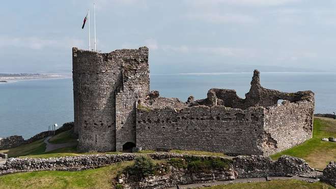 Explore a charming Welsh seaside town watched over by a dramatic clifftop castle.
