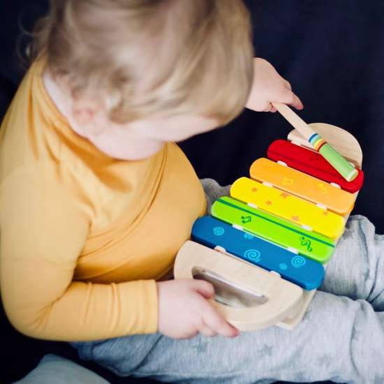 Toddler playing xylophone 
