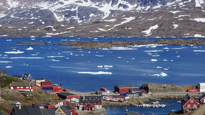 Visit one of Greenland's most remote and photogenic settlements, hemmed in by soaring crimson cliffs.