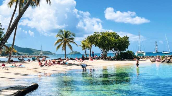 Relax on a golden Martinique beach across the bay from the capital, Fort-de-France.