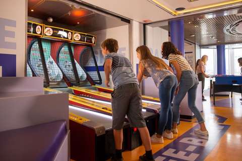 Image related to Three kids playing Skee-Ball in High Score