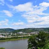 An image of a town across the river from a hilltop