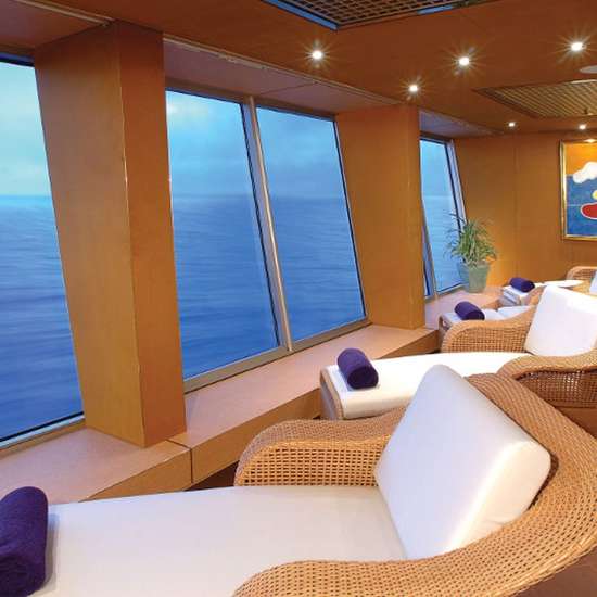 Loungers in a row looking out tall windows