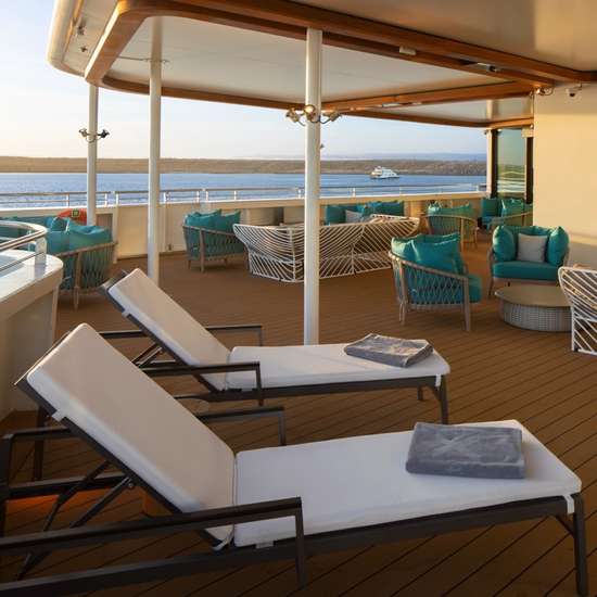 A selection of sun loungers on the deck of a cruise ship