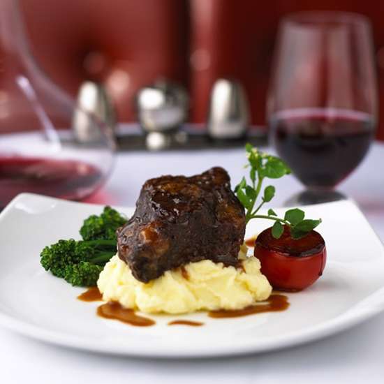 A steak on mash in a fine dining restaurant