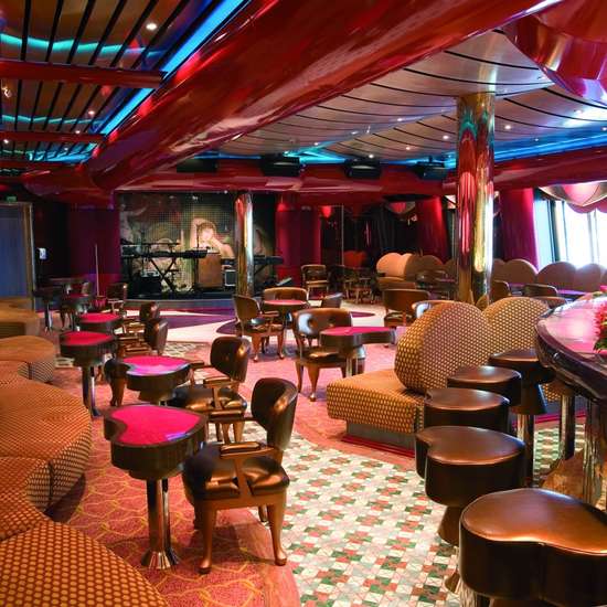 Heart-shaped tables and chairs in a red-themed bar