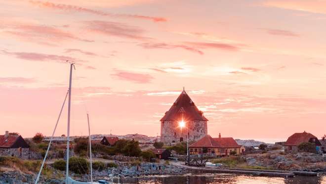 Wander a picturesque fishing village of half-timbered houses on the Danish island of Bornholm.