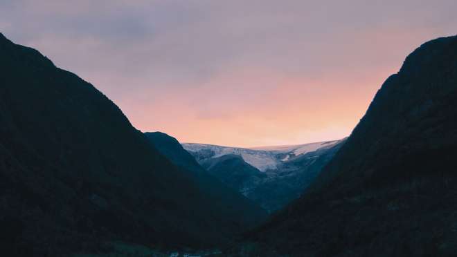 Step ashore at a quirky trapper's hut in a glacier-ringed northern Svalbard fjord.