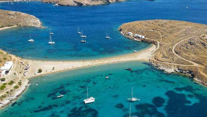Relax on a tranquil Cycladic island of thermal springs and golden sandy beaches.