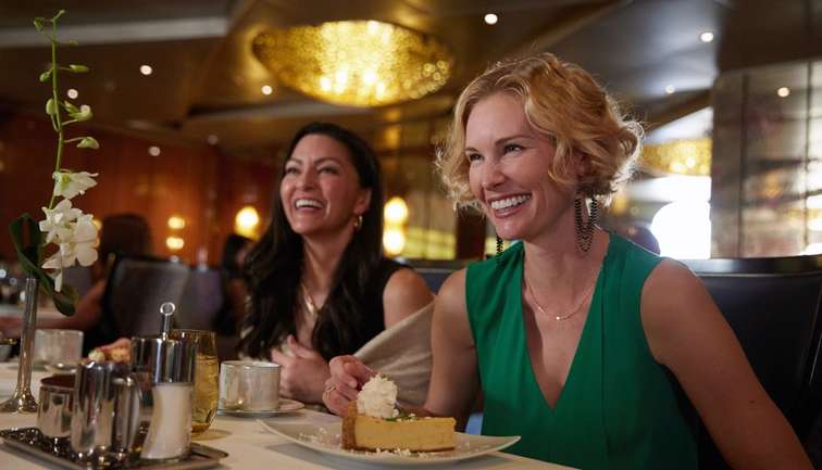 Two people enjoying a dessert in Pinnacle Grill