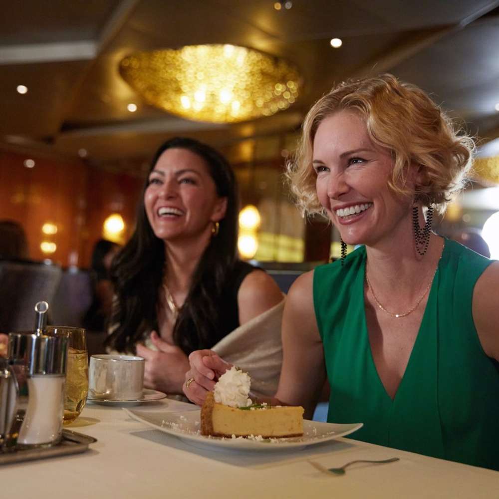 Two people enjoying a dessert in Pinnacle Grill