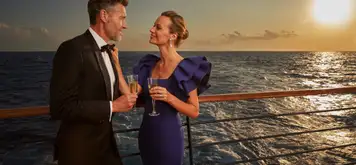 Image related to A couple on deck as the sun sets