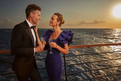 Image related to A couple on deck as the sun sets