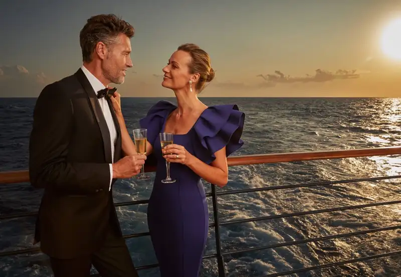 A couple on deck as the sun sets