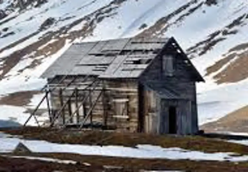 Examine Historic Trapper Cabins