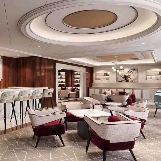 A stylish lounge with light décor, accented with brown and dark red