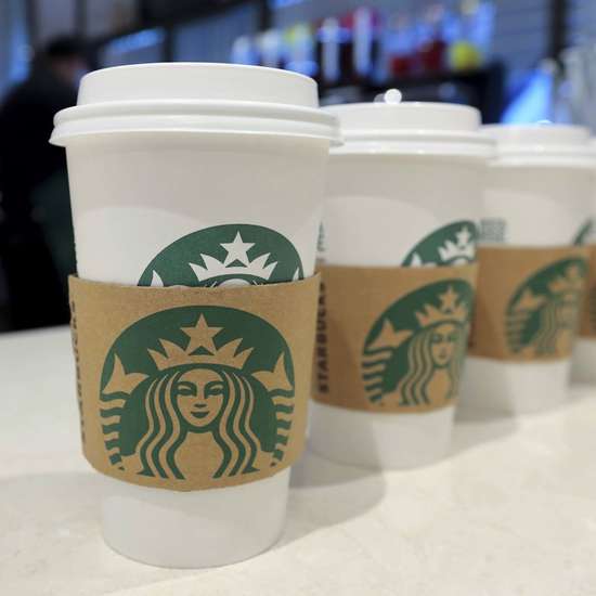 A row of starbucks cups